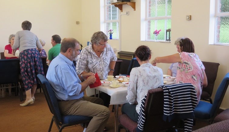 More guests being served tea.